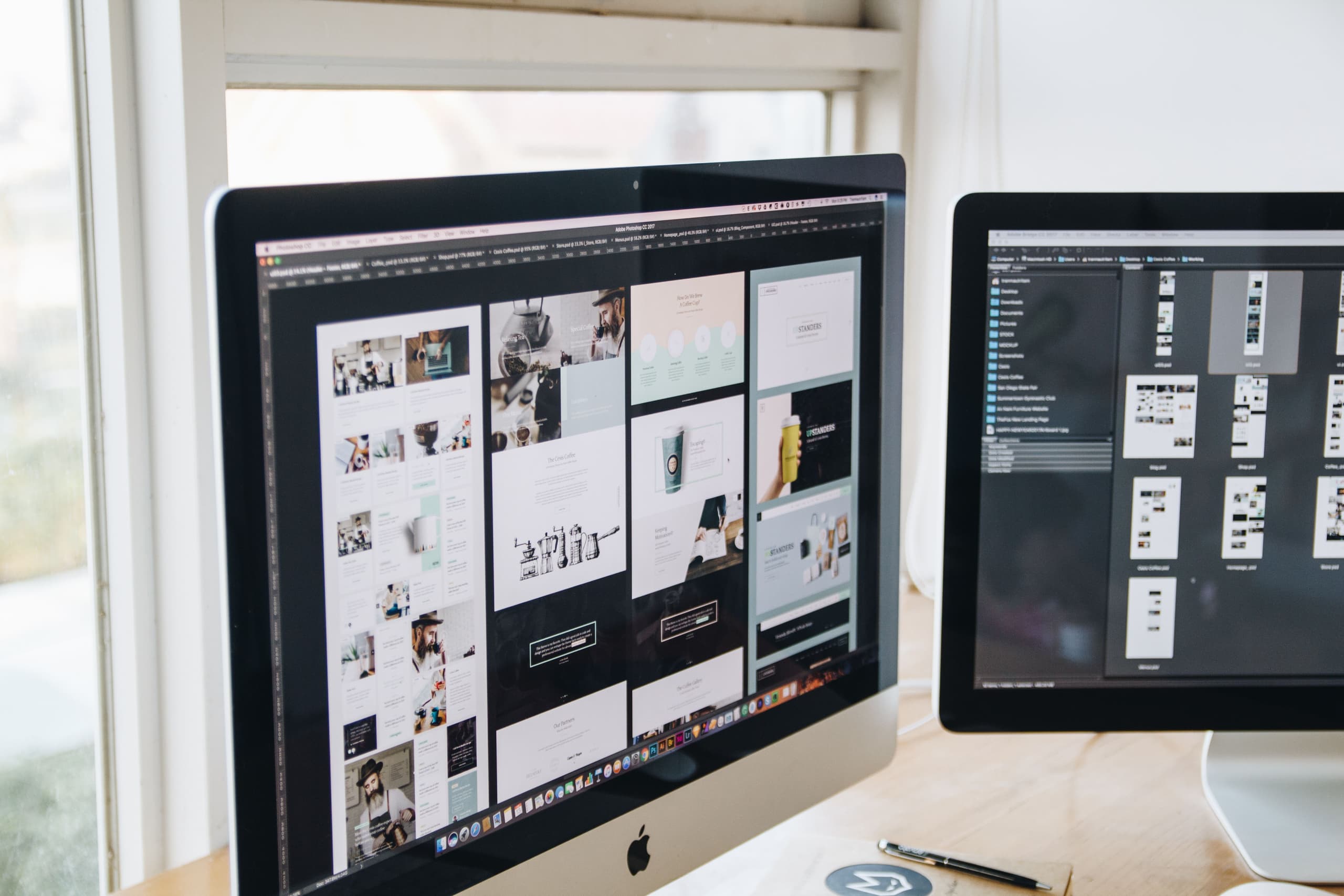 Website layouts and design options open across desktop monitors